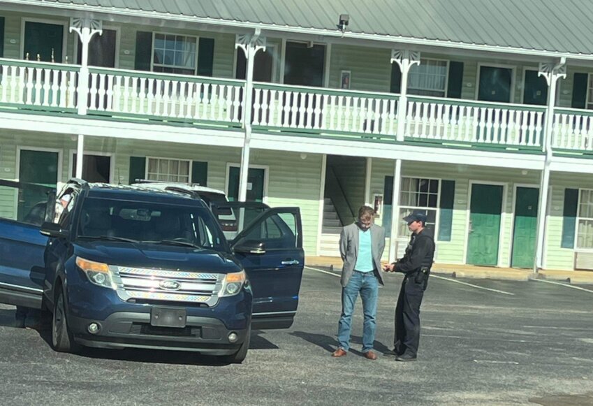 Thompson's arrest in the parking lot of the Deluxe Inn and Suites on Central Drive.